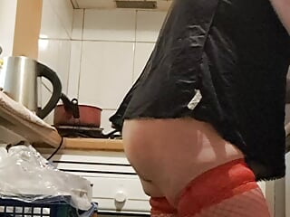 Wife in kitchen teasing husband to have sex while he watches