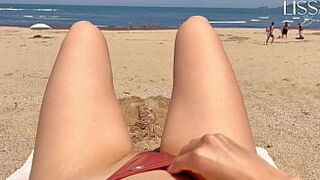 stranger fills my mouth on public beach