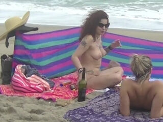 Exhibitionist milfs enjoy their day on the beach