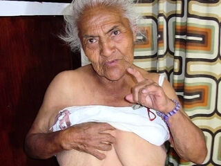 Granny squeezes her giant breasts with big nipples