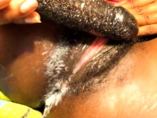 Hairy black MILF toys her pussy close up