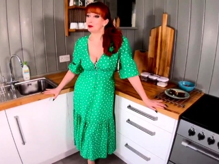 Mature redhead Red XXX fingers herself in the kitchen